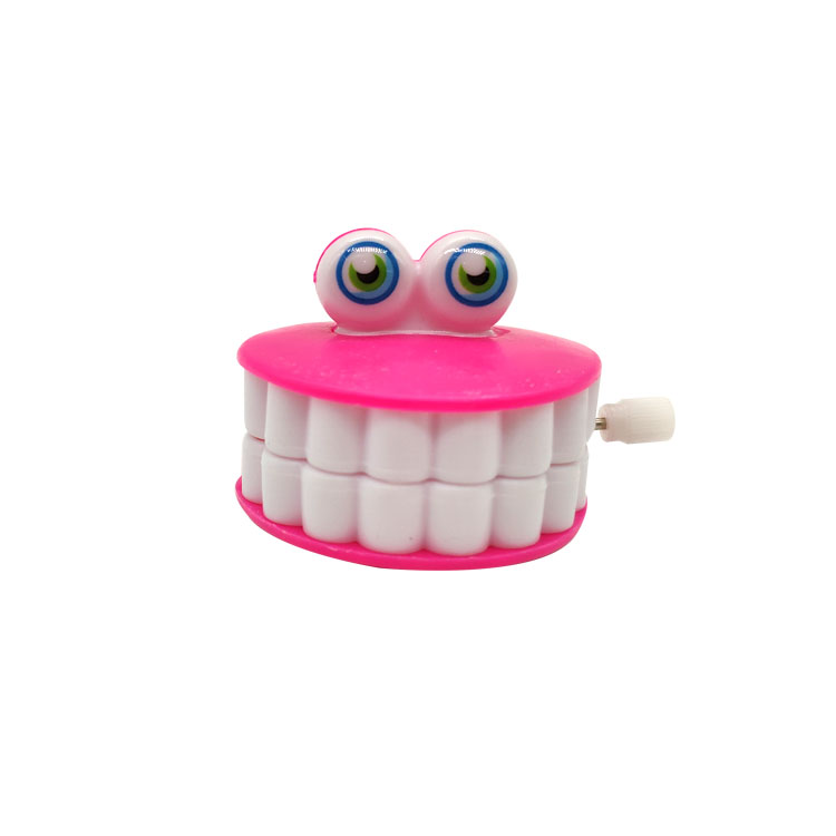 Giocattoli divertenti dei denti di plastica del versamento dei giocattoli dei denti